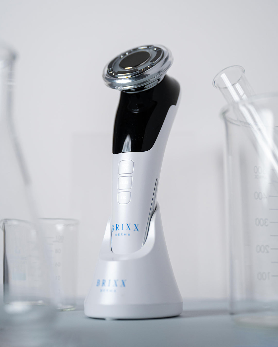 Brixx Derma Elite skincare device on a light gray background