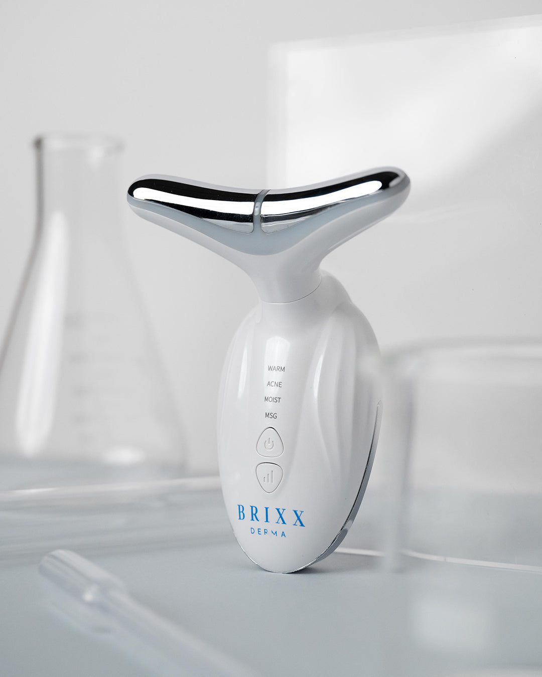 Sculpta-V with chrome accents on a light gray background, branded 'BRIXX'.